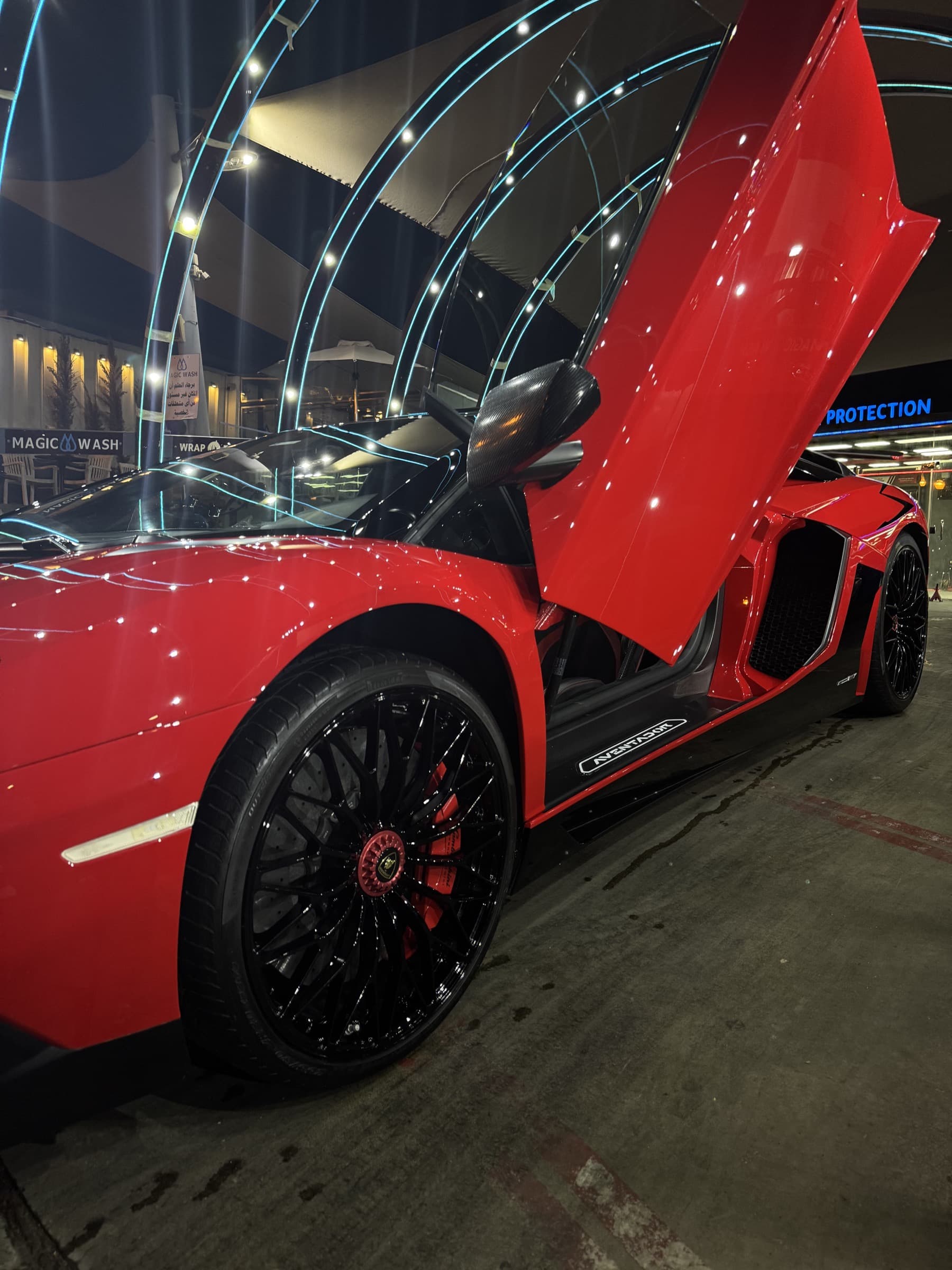 Supercar under neon arches
